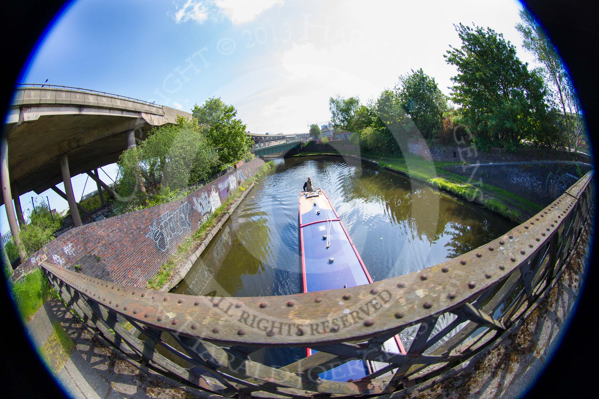 BCN Marathon Challenge 2013: NB "Felonious Mongoose" seen from the footbridge on the Old Main Line near Spon Lane Junction. Spon Lane Interchange Basin used to be on the left, where the graffiti is, the area has changed significantly when the M5 motoway was built..
Birmingham Canal Navigation,


United Kingdom,
on 25 May 2013 at 09:51, image #129