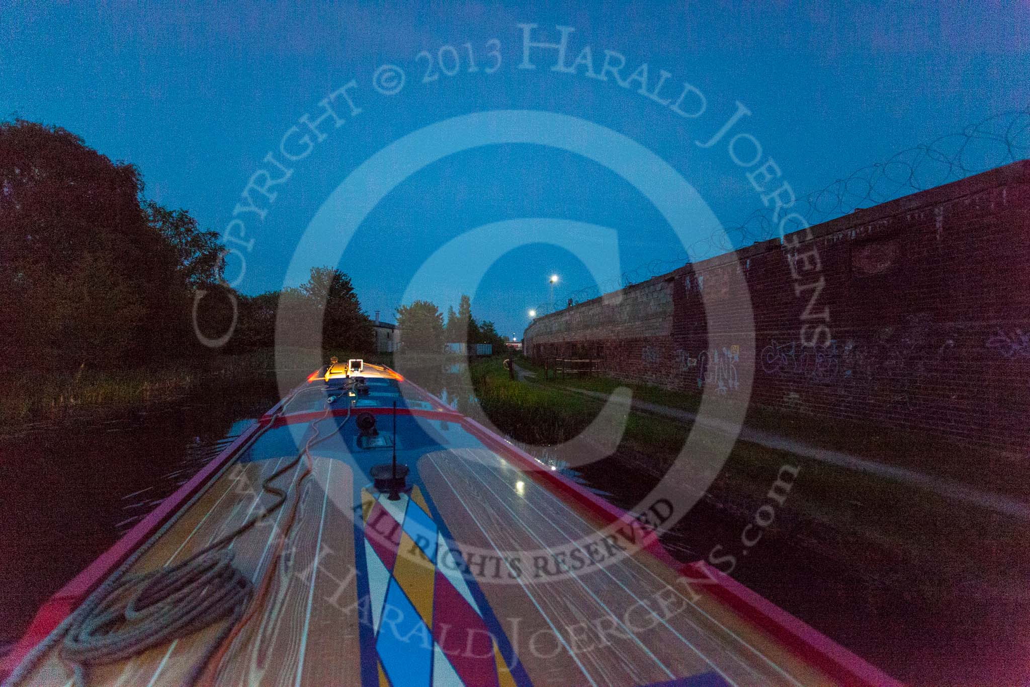 Photo 1305252141365D26007HaraldJoergens BCN Marathon Challenge 2013: Fading daylight, at 9:45pm, on the Walsall Canal near Bughole Bridge, with additional light installed on board of NB "Felonious Mongoose"..
Birmingham Canal Navigation,
United Kingdom,
on 25 May 2013 at 21:42, image #317