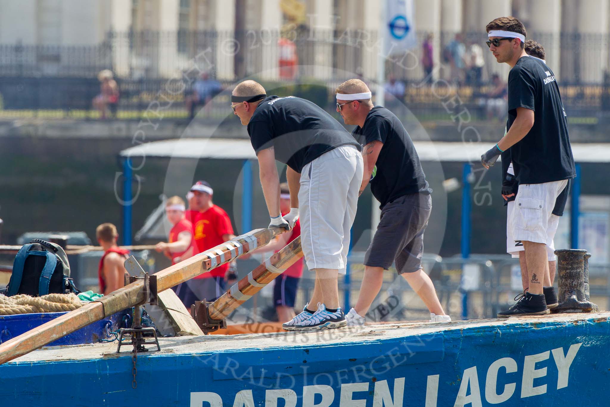 TOW River Thames Barge Driving Race 2013: The race is on - barge "Darren Lacey", by Princess Pocahontas, is pulled away from tug "Vincia". In the background the crew of barge "Spirit of Mountabatten", by Mechanical Movements and Enabling Services Ltd,.
River Thames between Greenwich and Westminster,
London,

United Kingdom,
on 13 July 2013 at 12:34, image #102