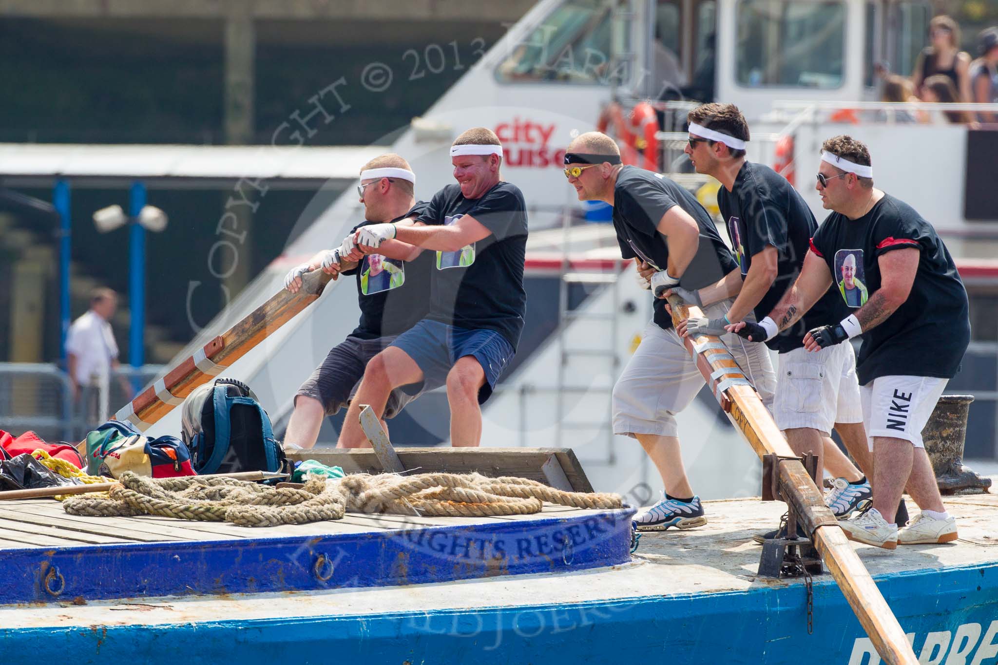 TOW River Thames Barge Driving Race 2013: The crew of barge "Darren Lacey", by Princess Pocahontas, rowing the barge from the start..
River Thames between Greenwich and Westminster,
London,

United Kingdom,
on 13 July 2013 at 12:35, image #108