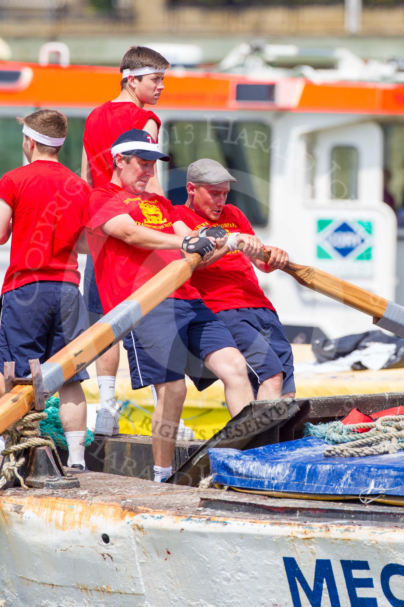 TOW River Thames Barge Driving Race 2013: Rowers on the deck of barge "Spirit of Mountabatten", by Mechanical Movements and Enabling Services Ltd, working hard during the race..
River Thames between Greenwich and Westminster,
London,

United Kingdom,
on 13 July 2013 at 12:39, image #154