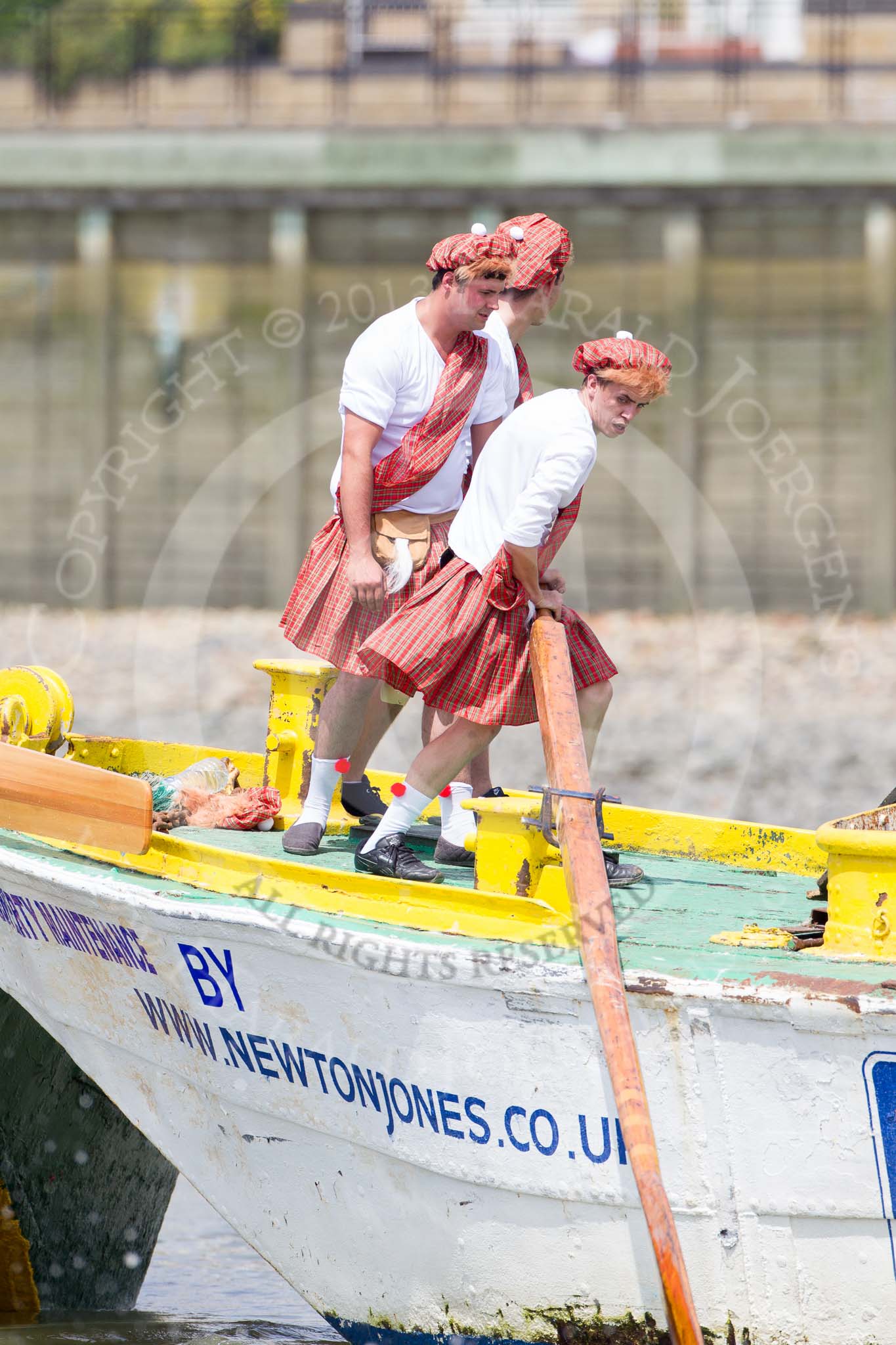 TOW River Thames Barge Driving Race 2013: Rowers wearing skirts on the deck of of barge "Hoppy" by GPS Fabrication..
River Thames between Greenwich and Westminster,
London,

United Kingdom,
on 13 July 2013 at 12:39, image #156