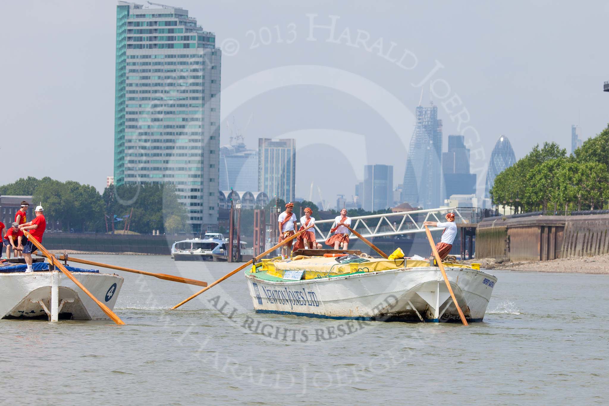 TOW River Thames Barge Driving Race 2013: Barge "Hoppy", by GPS Fabrication, approaching Masthouse Terrace Pier. On the left barge "Spirit of Mountabatten", by Mechanical Movements and Enabling Services Ltd. In the background the skyscrapers of the City of London..
River Thames between Greenwich and Westminster,
London,

United Kingdom,
on 13 July 2013 at 12:41, image #167