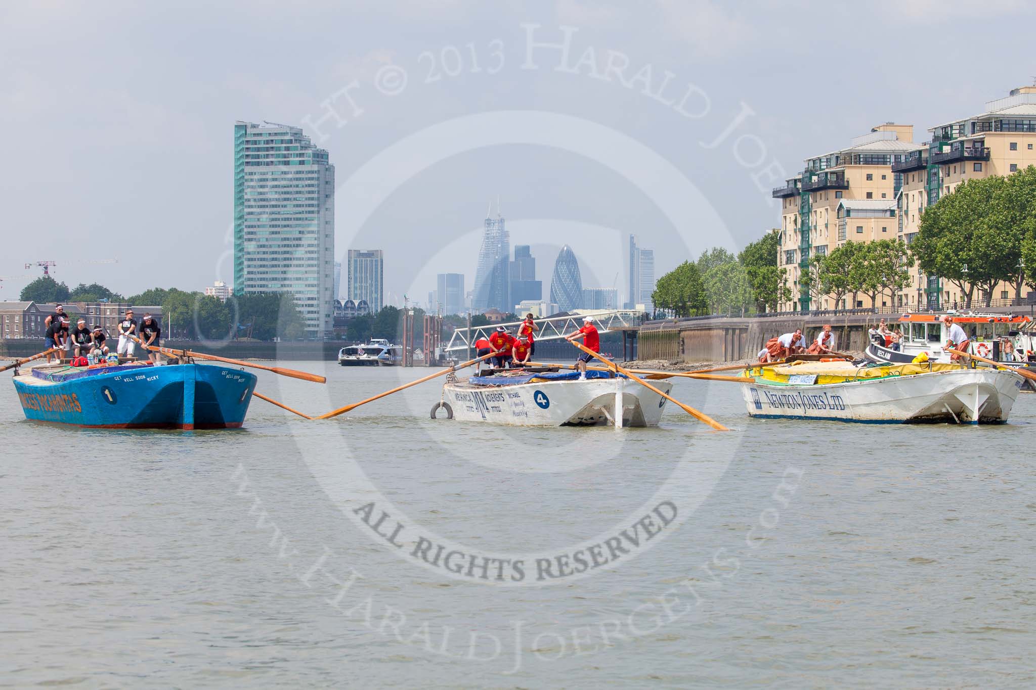 TOW River Thames Barge Driving Race 2013: Three barges abreast - from left "Darren Lacey", by Princess Pocahontas, "Spirit of Mountabatten", by Mechanical Movements and Enabling Services Ltd, and "Hoppy", by GPS Fabrication, approaching Masthouse Terrace Pier. In the background the skyscrapers in the City of London..
River Thames between Greenwich and Westminster,
London,

United Kingdom,
on 13 July 2013 at 12:41, image #172