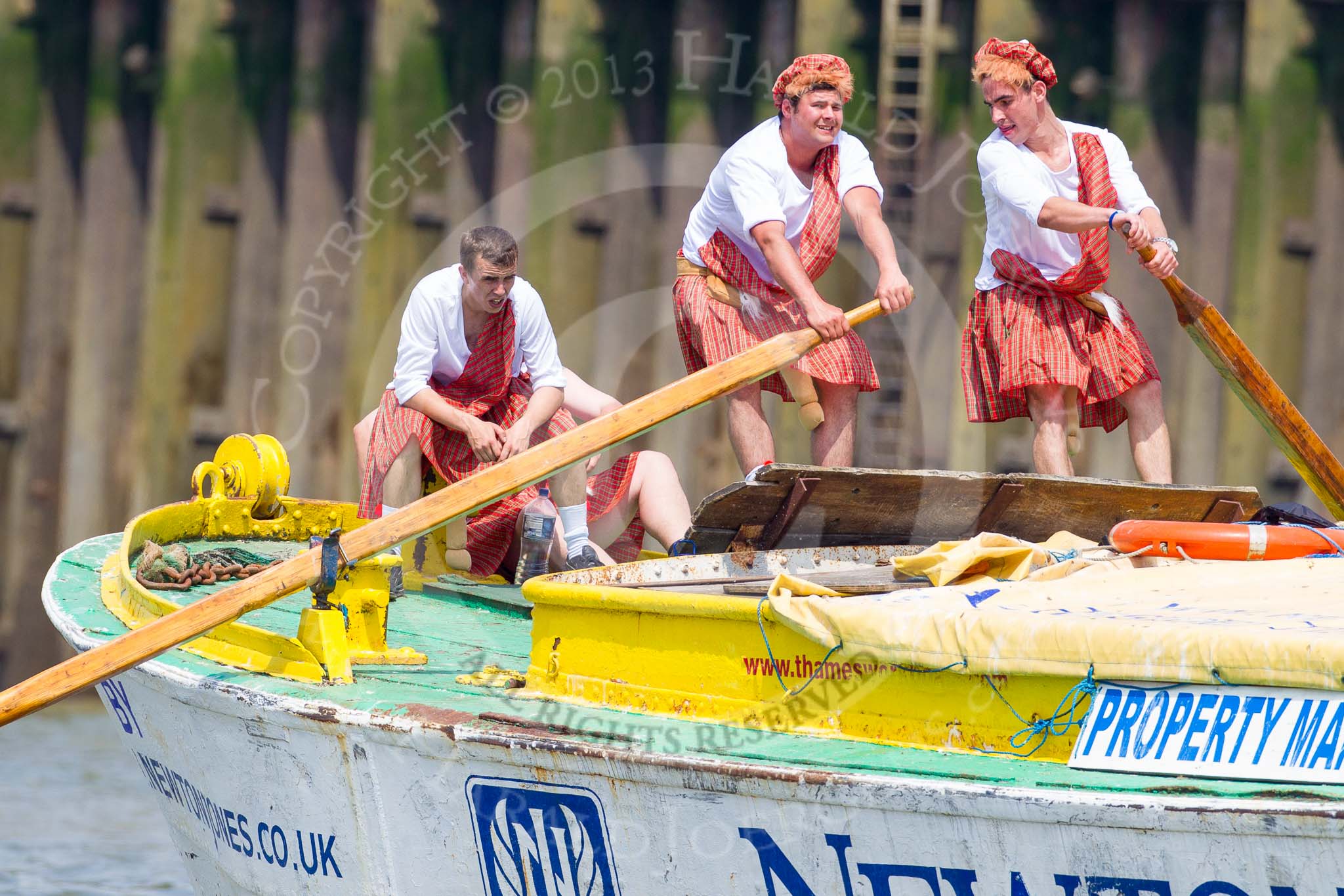 TOW River Thames Barge Driving Race 2013: rowers wearing skirts on the deck of of barge "Hoppy" by GPS Fabrication..
River Thames between Greenwich and Westminster,
London,

United Kingdom,
on 13 July 2013 at 12:48, image #217