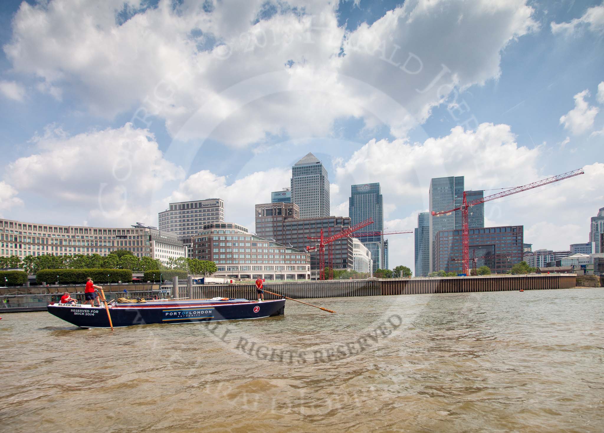 TOW River Thames Barge Driving Race 2013: Barge "Blackwall", by the Port of London Authority, in front the skyscrapers of Canary Wharf..
River Thames between Greenwich and Westminster,
London,

United Kingdom,
on 13 July 2013 at 13:11, image #285