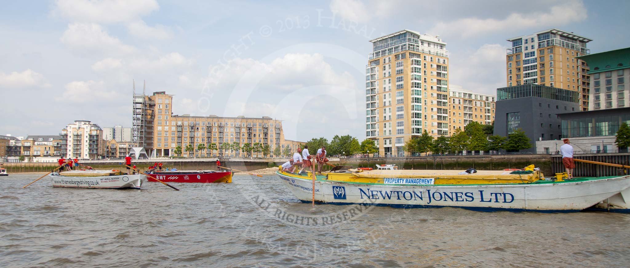 TOW River Thames Barge Driving Race 2013: Barge "Shell Bay" by South Dock Marina, followed by barge "Jane", by the RMT Union, and barge "Hoppy", by GPS Fabrication, near Canary Wharf Pier..
River Thames between Greenwich and Westminster,
London,

United Kingdom,
on 13 July 2013 at 13:15, image #298