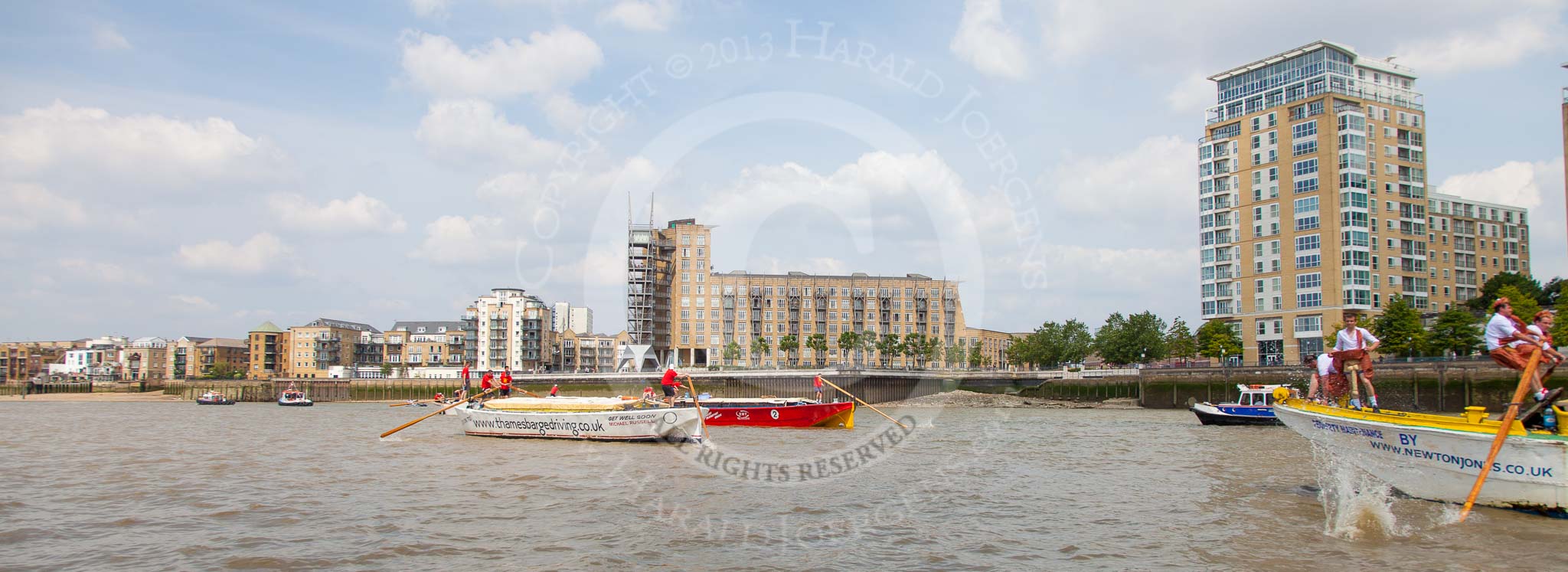 TOW River Thames Barge Driving Race 2013: Barge "Shell Bay" by South Dock Marina, followed by barge "Jane", by the RMT Union, and barge "Hoppy", by GPS Fabrication, near Canary Wharf Pier..
River Thames between Greenwich and Westminster,
London,

United Kingdom,
on 13 July 2013 at 13:15, image #300