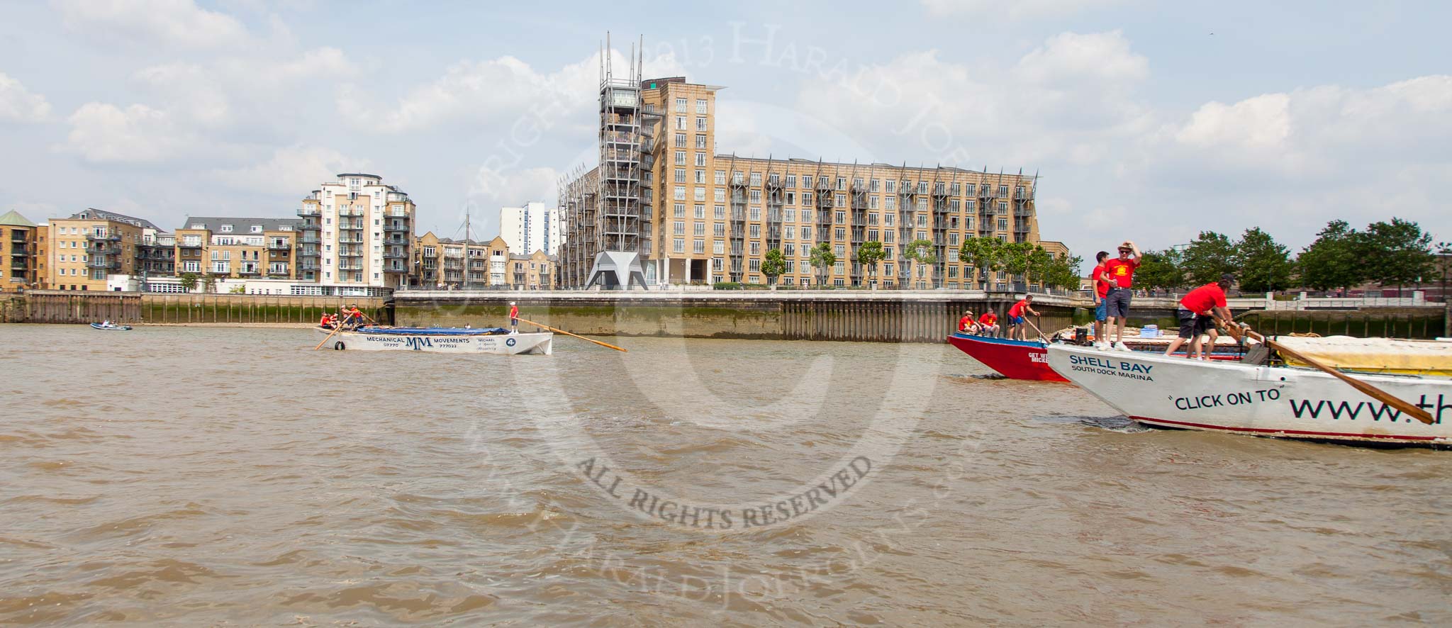TOW River Thames Barge Driving Race 2013: Barge "Shell Bay" by South Dock Marina, followed by barge "Jane", by the RMT Union, and barge "Shell Bay" by South Dock Marina, near Canary Wharf Pier..
River Thames between Greenwich and Westminster,
London,

United Kingdom,
on 13 July 2013 at 13:16, image #302