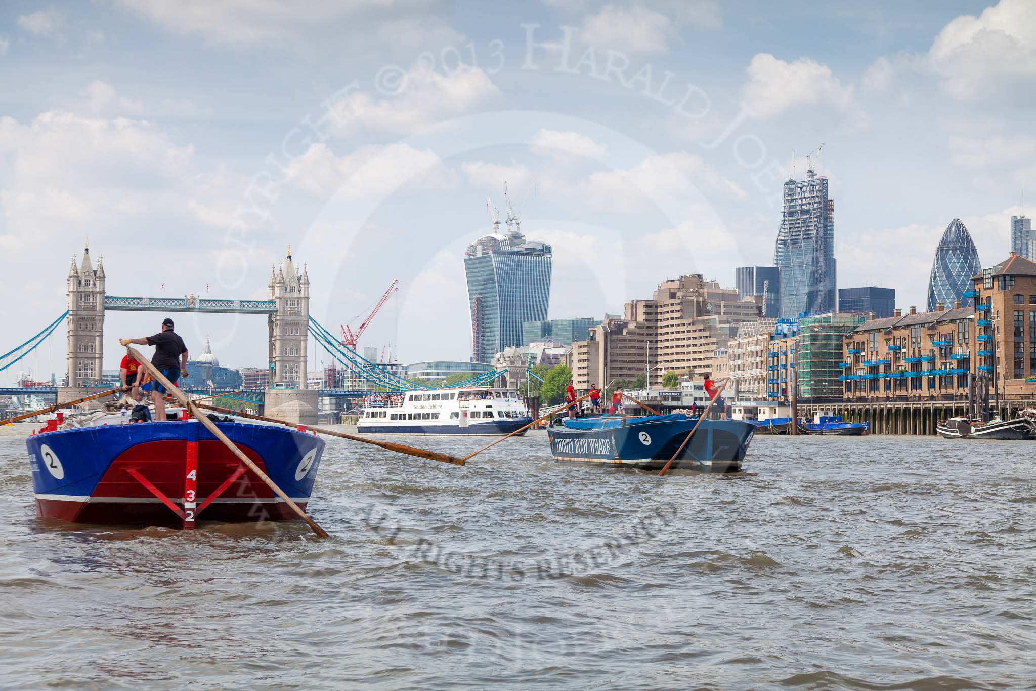 TOW River Thames Barge Driving Race 2013: Barge "Steve Faldo" by Capital Pleasure Boats, and barge "Diana", by Trinity Buoy Wharf, approaching Tower Bridge, On the right the Walkie Talkie- and the Gherkin building..
River Thames between Greenwich and Westminster,
London,

United Kingdom,
on 13 July 2013 at 13:35, image #367