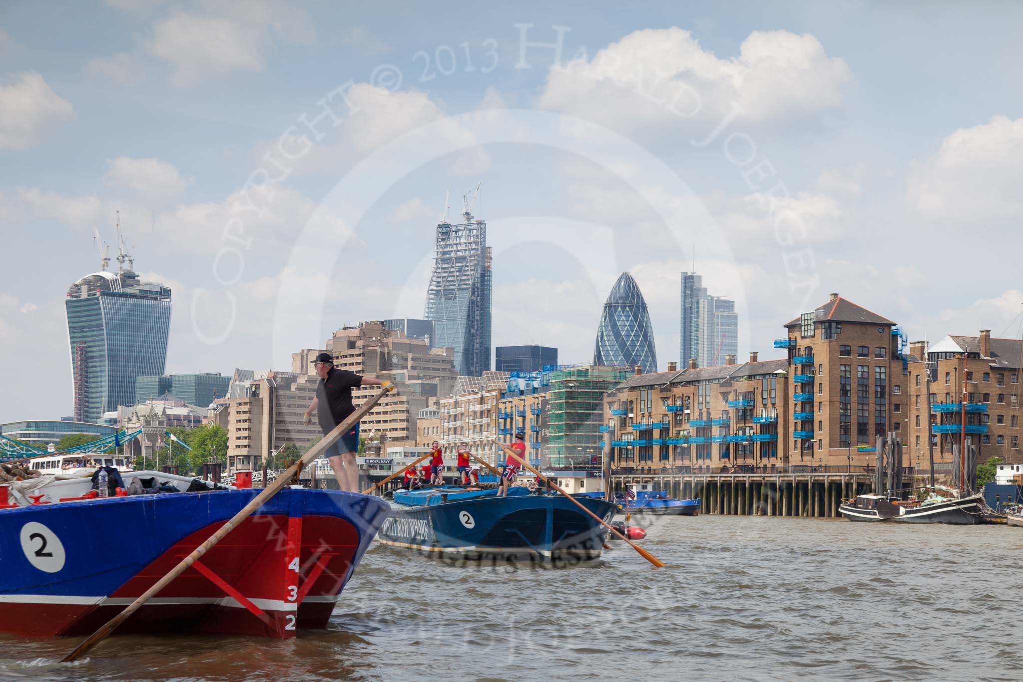 TOW River Thames Barge Driving Race 2013: Barge "Steve Faldo" by Capital Pleasure Boats, and barge "Diana", by Trinity Buoy Wharf, approaching Tower Bridge, In the background the Walkie Talkie- and the Gherkin building..
River Thames between Greenwich and Westminster,
London,

United Kingdom,
on 13 July 2013 at 13:35, image #368