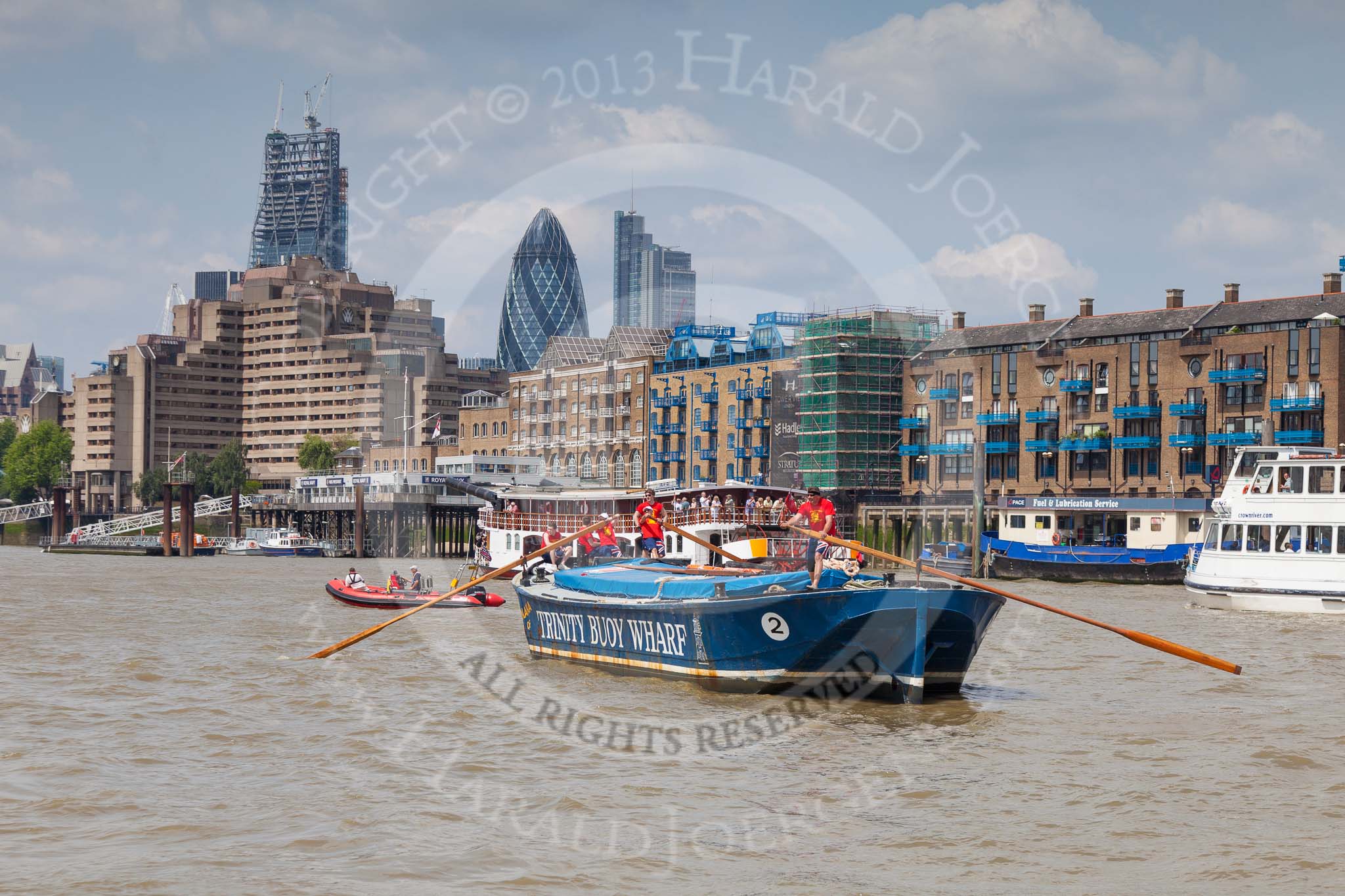 TOW River Thames Barge Driving Race 2013: Barge "Diana", by Trinity Buoy Wharf, approaching "HMS President" on the right, with the "Gherkin" buiilding behind..
River Thames between Greenwich and Westminster,
London,

United Kingdom,
on 13 July 2013 at 13:36, image #369