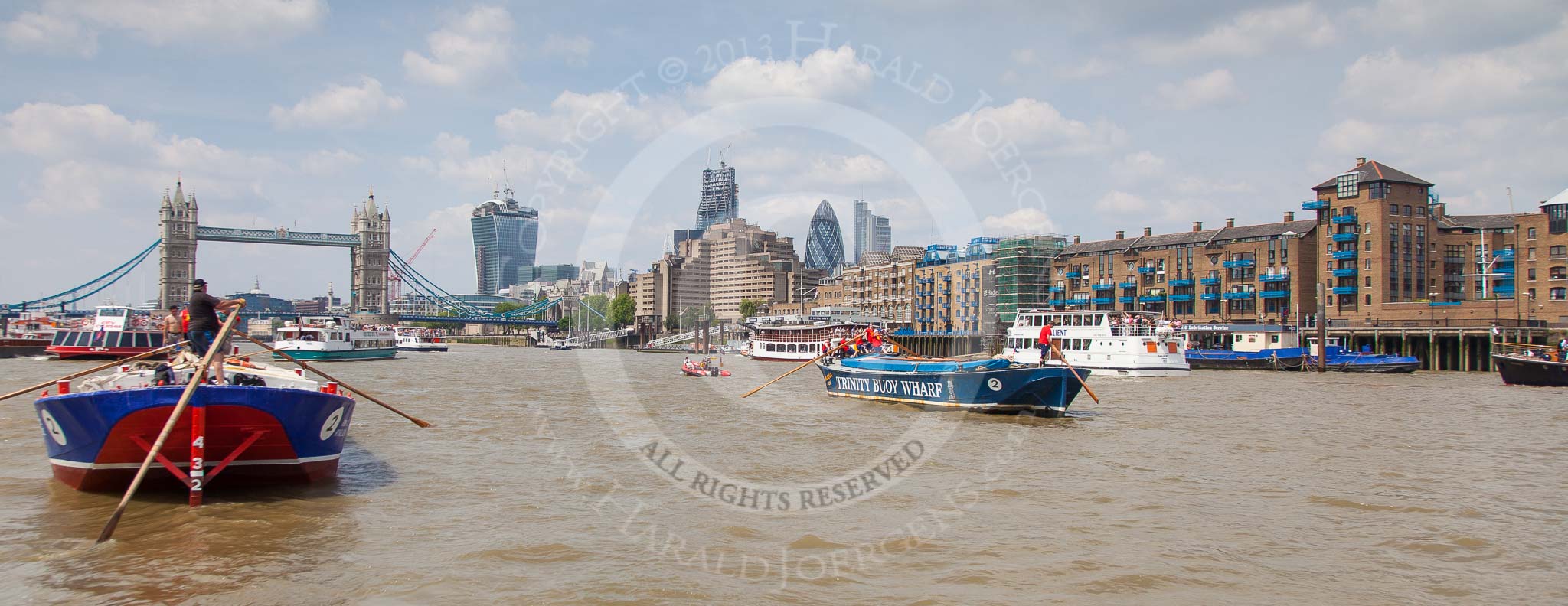 TOW River Thames Barge Driving Race 2013: Barge "Steve Faldo" by Capital Pleasure Boats, and barge "Diana", by Trinity Buoy Wharf, approaching Tower Bridge, On the right the Walkie Talkie- and the Gherkin building..
River Thames between Greenwich and Westminster,
London,

United Kingdom,
on 13 July 2013 at 13:36, image #370