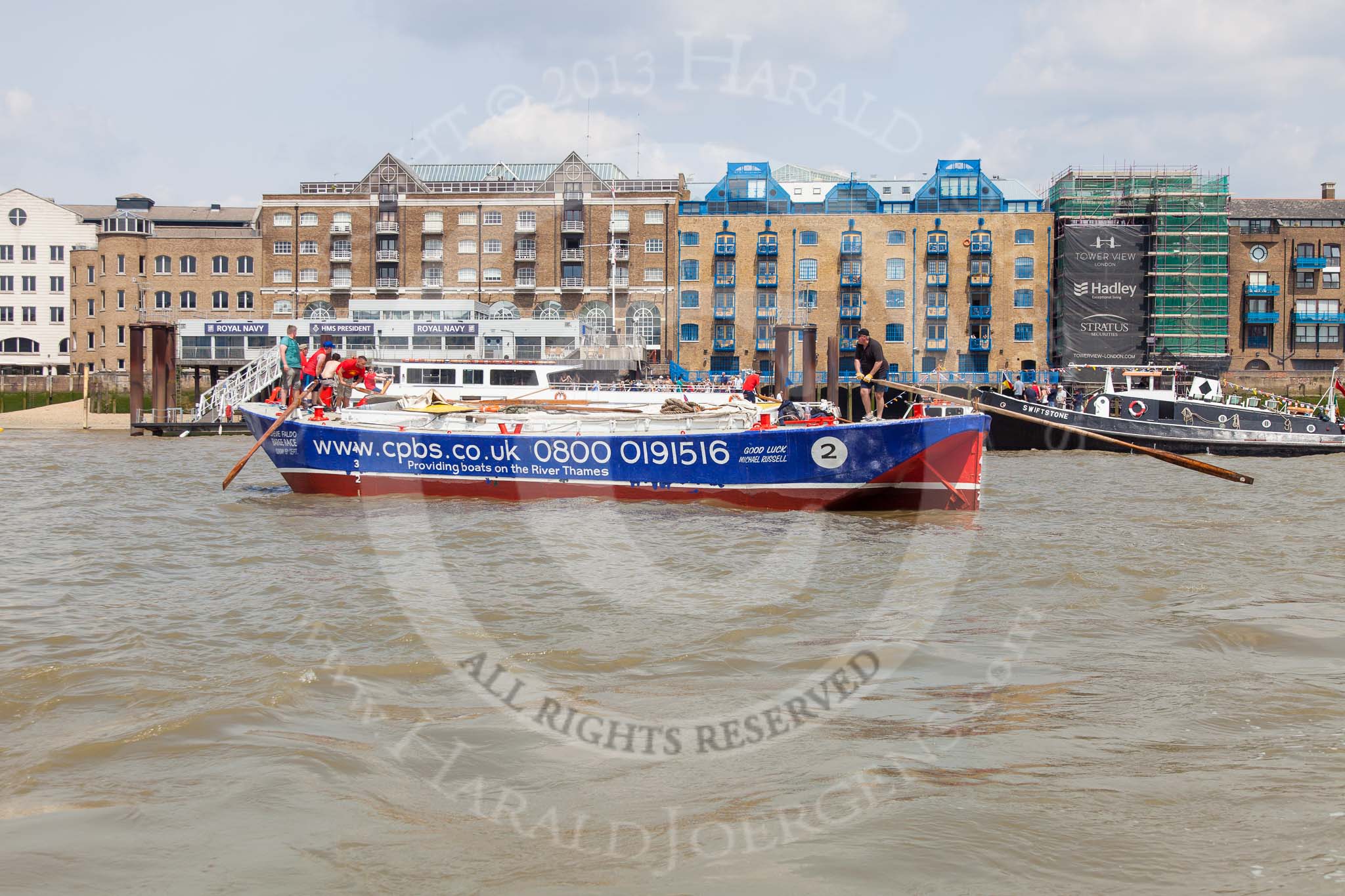 TOW River Thames Barge Driving Race 2013: Barge "Steve Faldo" by Capital Pleasure Boats, passing the Royal Navy "HMS President"..
River Thames between Greenwich and Westminster,
London,

United Kingdom,
on 13 July 2013 at 13:39, image #374