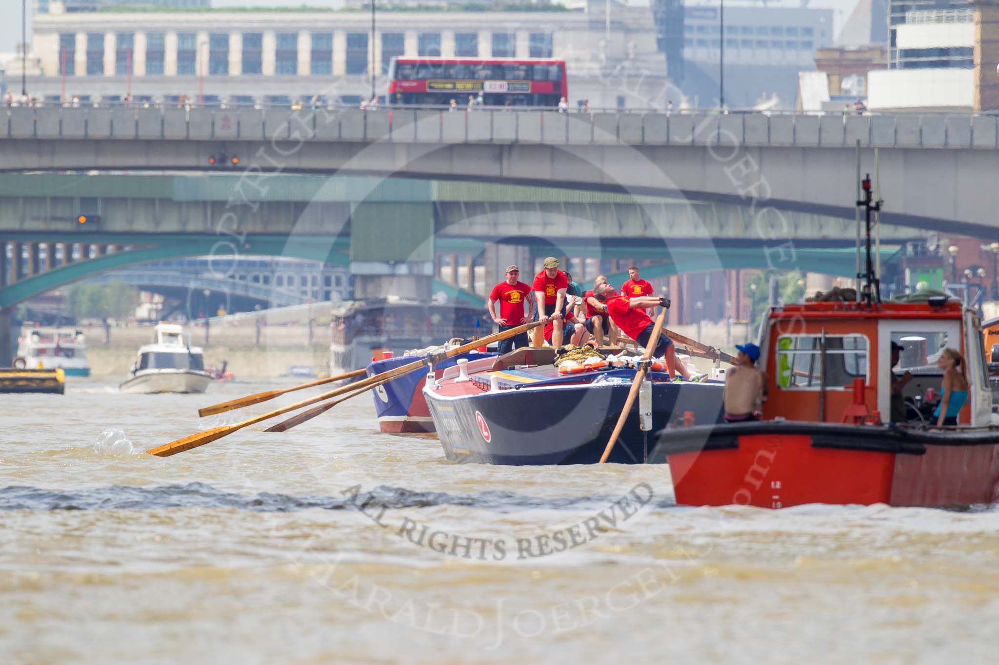 TOW River Thames Barge Driving Race 2013: Barge "Blackwall", by the Port of London Authority, passing HMS Belfast. In frontis barge "Steve Faldo" by Capital Pleasure Boats..
River Thames between Greenwich and Westminster,
London,

United Kingdom,
on 13 July 2013 at 13:44, image #385