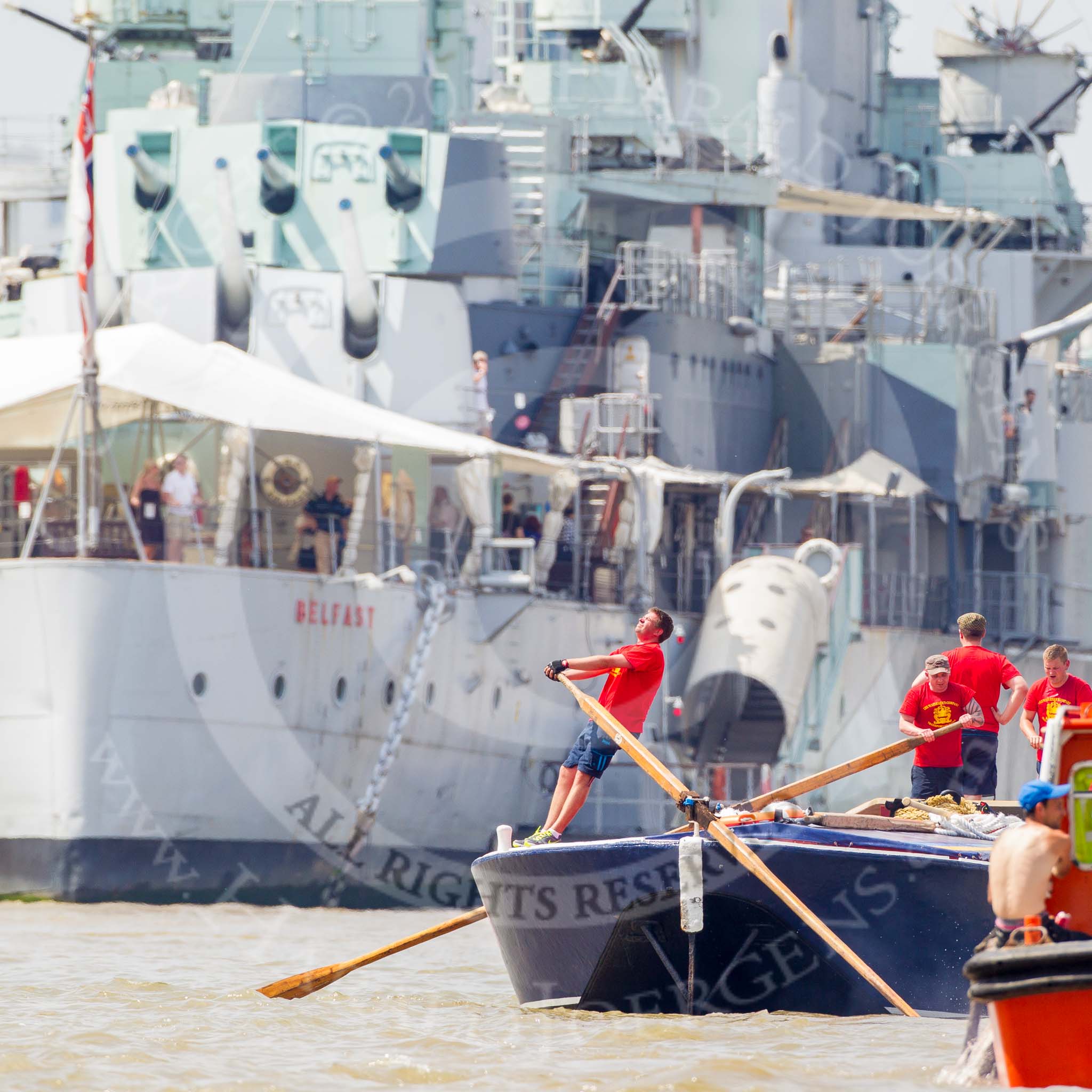 TOW River Thames Barge Driving Race 2013: Barge "Blackwall", by the Port of London Authority,approaching HMS Belfast..
River Thames between Greenwich and Westminster,
London,

United Kingdom,
on 13 July 2013 at 13:45, image #388