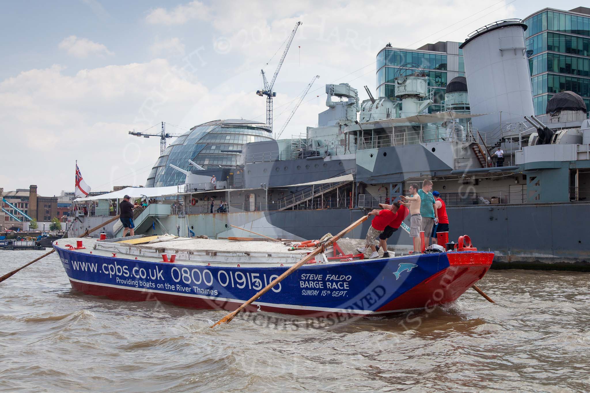 TOW River Thames Barge Driving Race 2013: Barge "Steve Faldo", by Capital Pleasure Boats, passing HMS Belfast..
River Thames between Greenwich and Westminster,
London,

United Kingdom,
on 13 July 2013 at 13:47, image #396