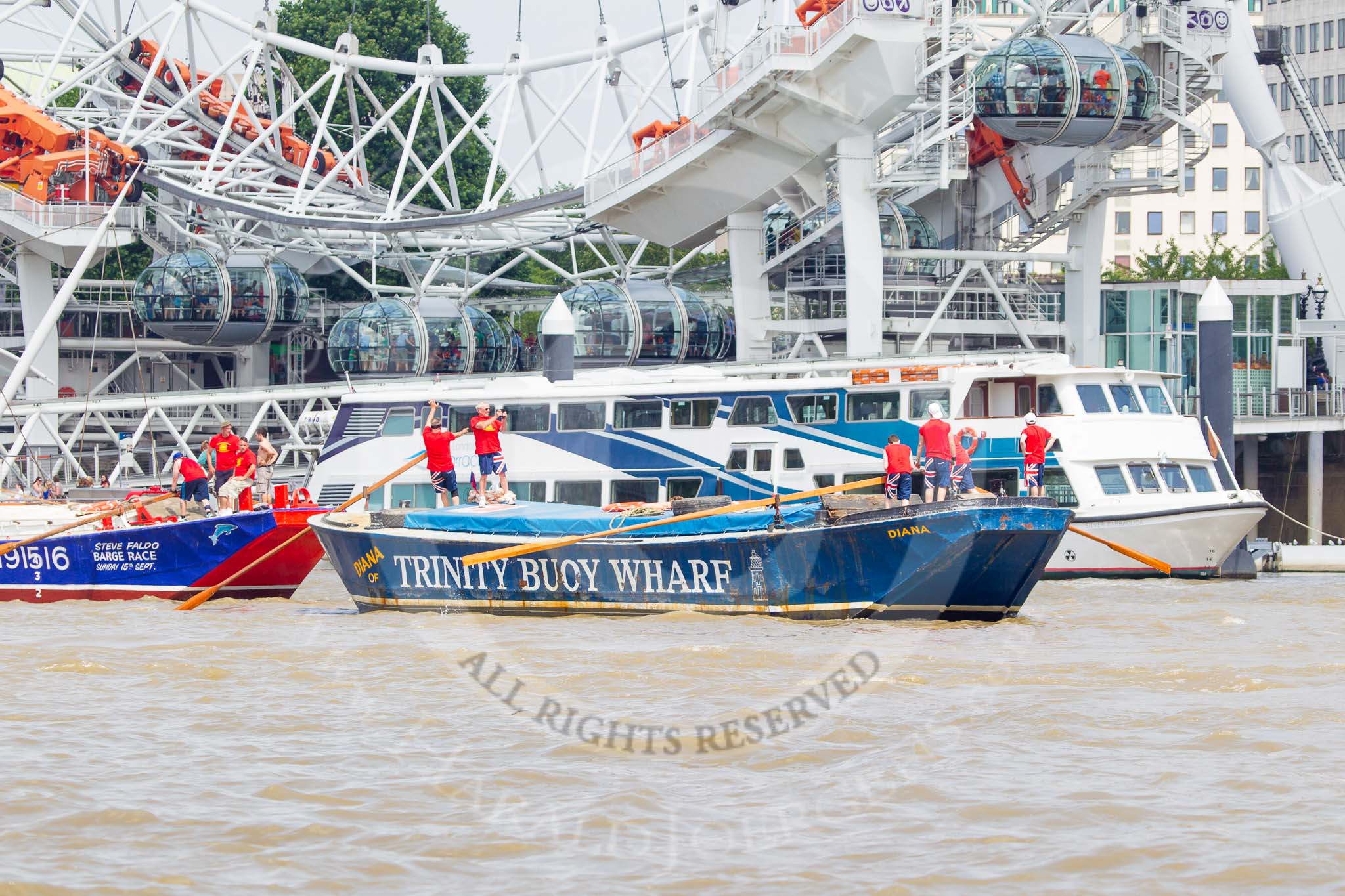 TOW River Thames Barge Driving Race 2013: Barge "Diana", by Trinity Buoy Wharf, at the London Eye, followed by barge "Steve Faldo" by Capital Pleasure Boats, close to the finish of the race at Westminster Bridge..
River Thames between Greenwich and Westminster,
London,

United Kingdom,
on 13 July 2013 at 14:17, image #423