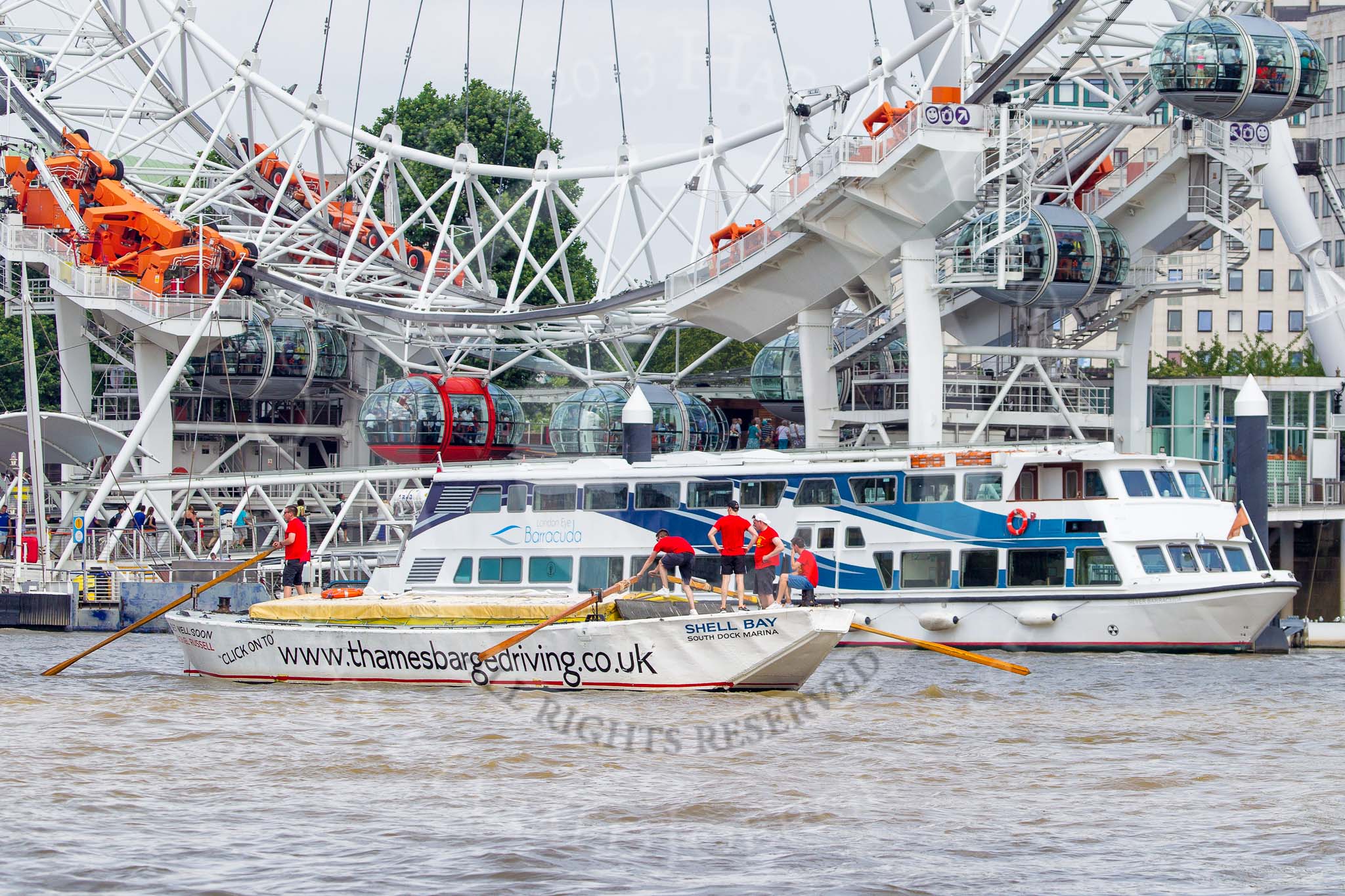 TOW River Thames Barge Driving Race 2013: Barge ""Shell Bay" by South Dock Marina, at the London Eye, close to the finish of the race at Westminster Bridge..
River Thames between Greenwich and Westminster,
London,

United Kingdom,
on 13 July 2013 at 14:23, image #441