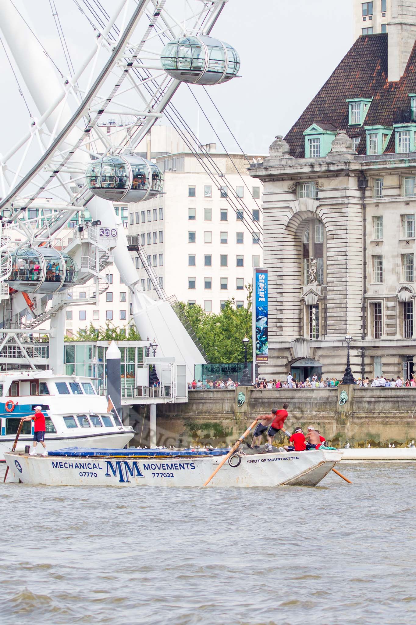 TOW River Thames Barge Driving Race 2013: Barge "Spirit of Mountabatten", by Mechanical Movements and Enabling Services Ltd, at the London Eye, close to the finish of the race at Westminster Bridge..
River Thames between Greenwich and Westminster,
London,

United Kingdom,
on 13 July 2013 at 14:25, image #457