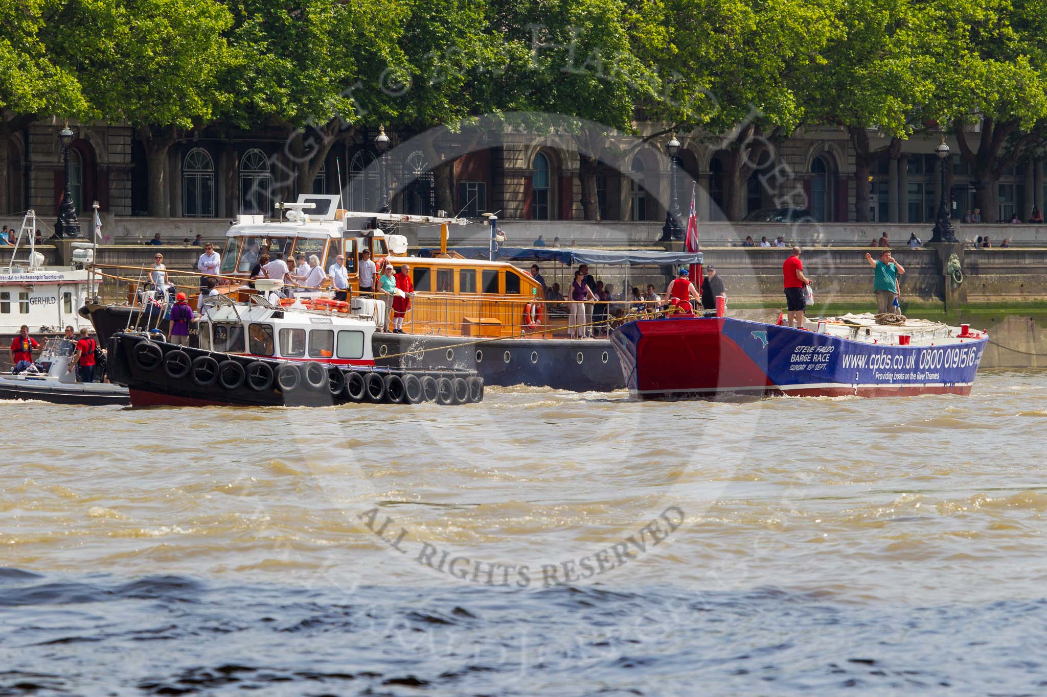 TOW River Thames Barge Driving Race 2013: Barge "Steve Faldo" by Capital Pleasure Boats, behind the finish line at Westminster Bridge, ready to be towed back to Greenwich by tug "Bulldog". Behind them is MV Havengore, hosting VIP guests..
River Thames between Greenwich and Westminster,
London,

United Kingdom,
on 13 July 2013 at 14:33, image #483