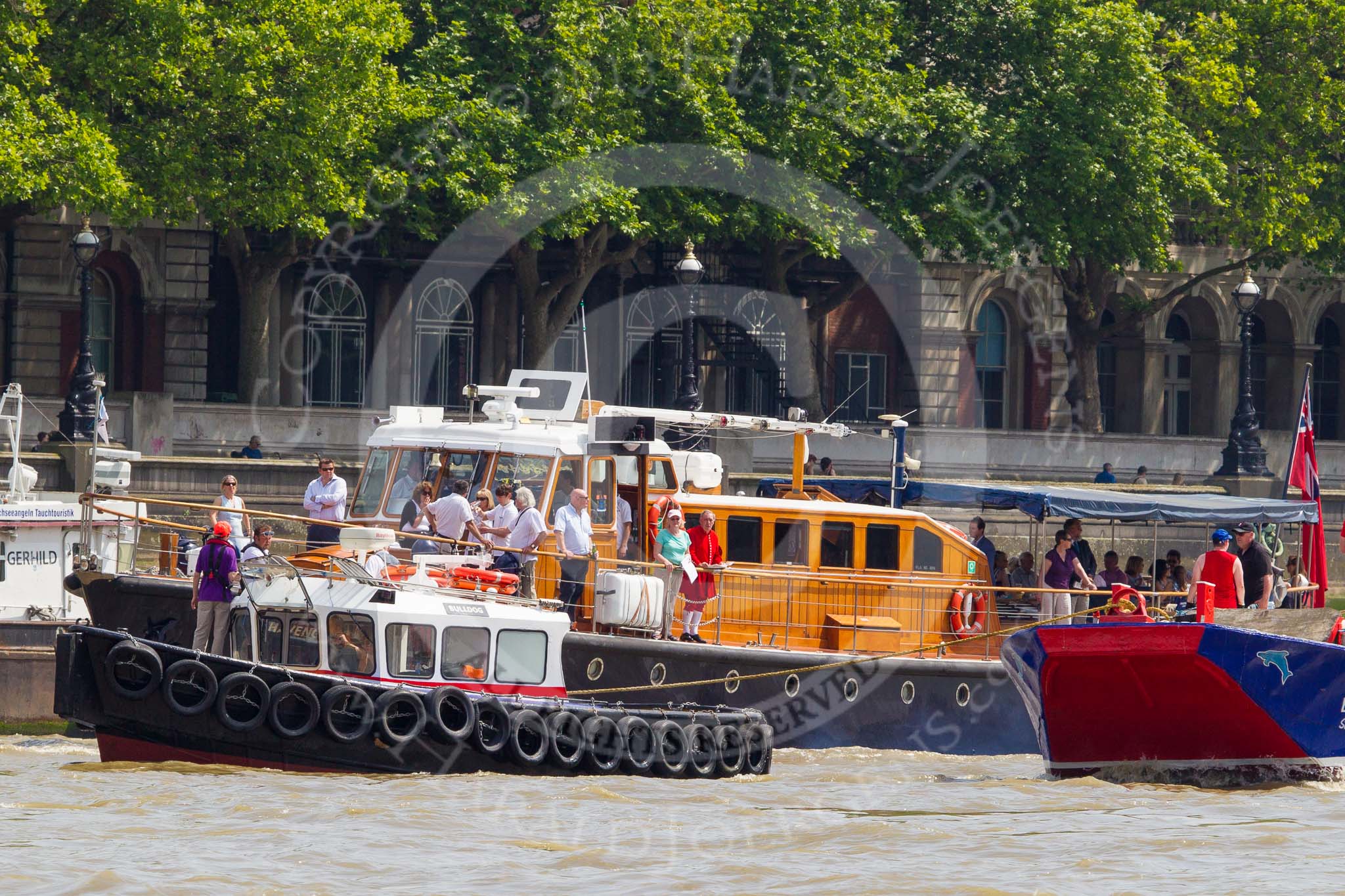 TOW River Thames Barge Driving Race 2013: Barge "Steve Faldo" by Capital Pleasure Boats, behind the finish line at Westminster Bridge, ready to be towed back to Greenwich by tug "Bulldog". Behind them is MV Havengore, hosting VIP guests..
River Thames between Greenwich and Westminster,
London,

United Kingdom,
on 13 July 2013 at 14:33, image #484