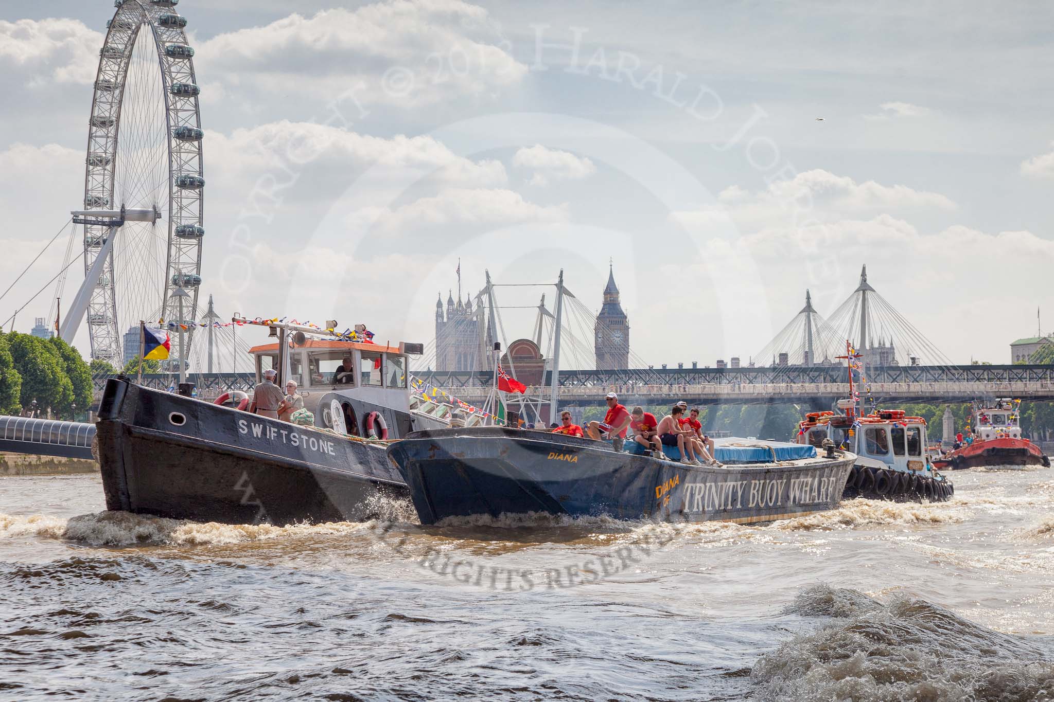 TOW River Thames Barge Driving Race 2013: Tug "Swiftstone" pullig barge "Diana", by Trinity Buoy Wharf, back to Greenwich. In the backround the London Eye, Westminster Bridge, and Big Ben..
River Thames between Greenwich and Westminster,
London,

United Kingdom,
on 13 July 2013 at 14:47, image #526