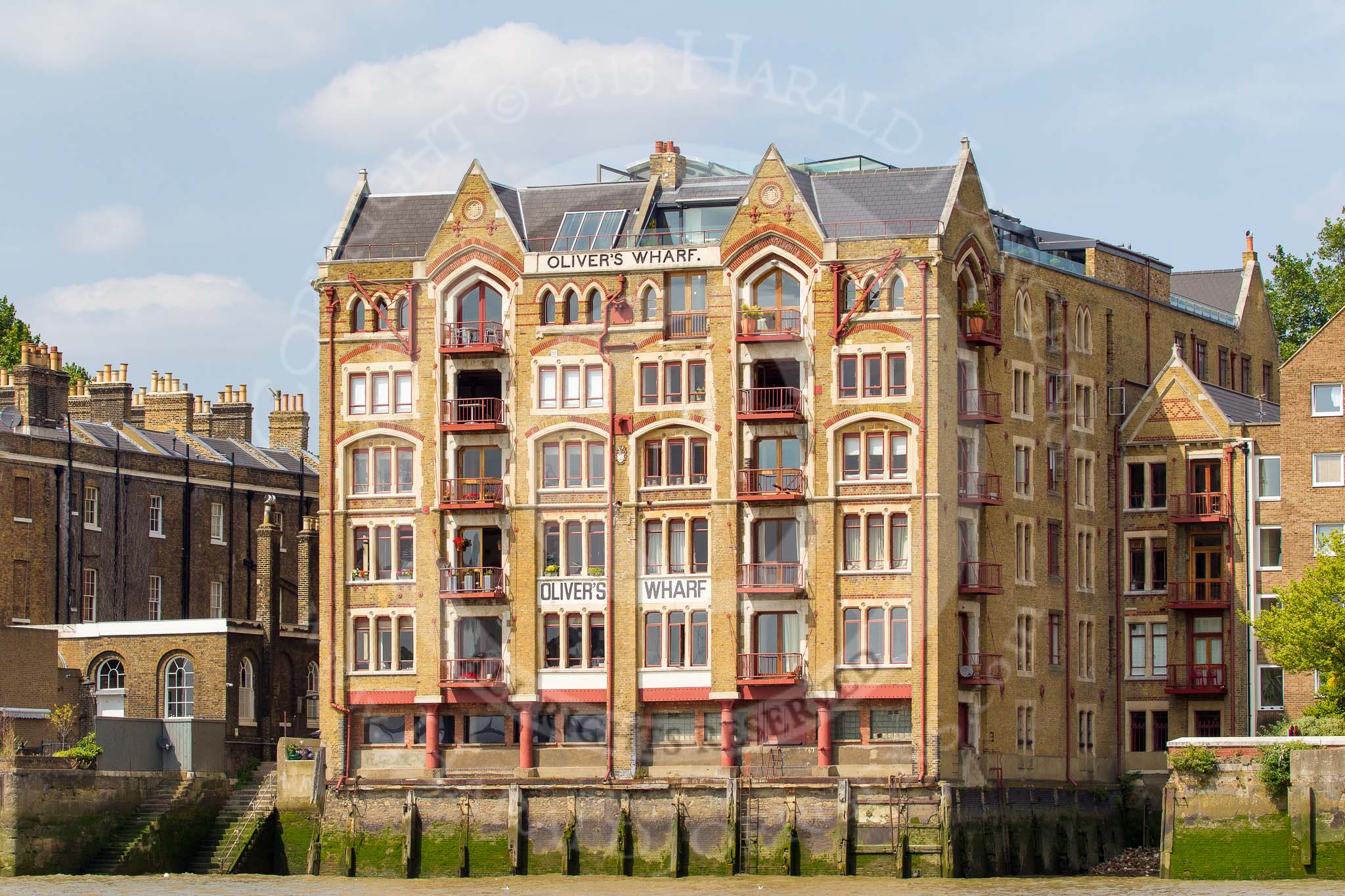 TOW River Thames Barge Driving Race 2013: Oliver's Wharf, a Vivtorian warehouse conversion, at Wapping High St, London E1W, seen from the river..
River Thames between Greenwich and Westminster,
London,

United Kingdom,
on 13 July 2013 at 15:06, image #547