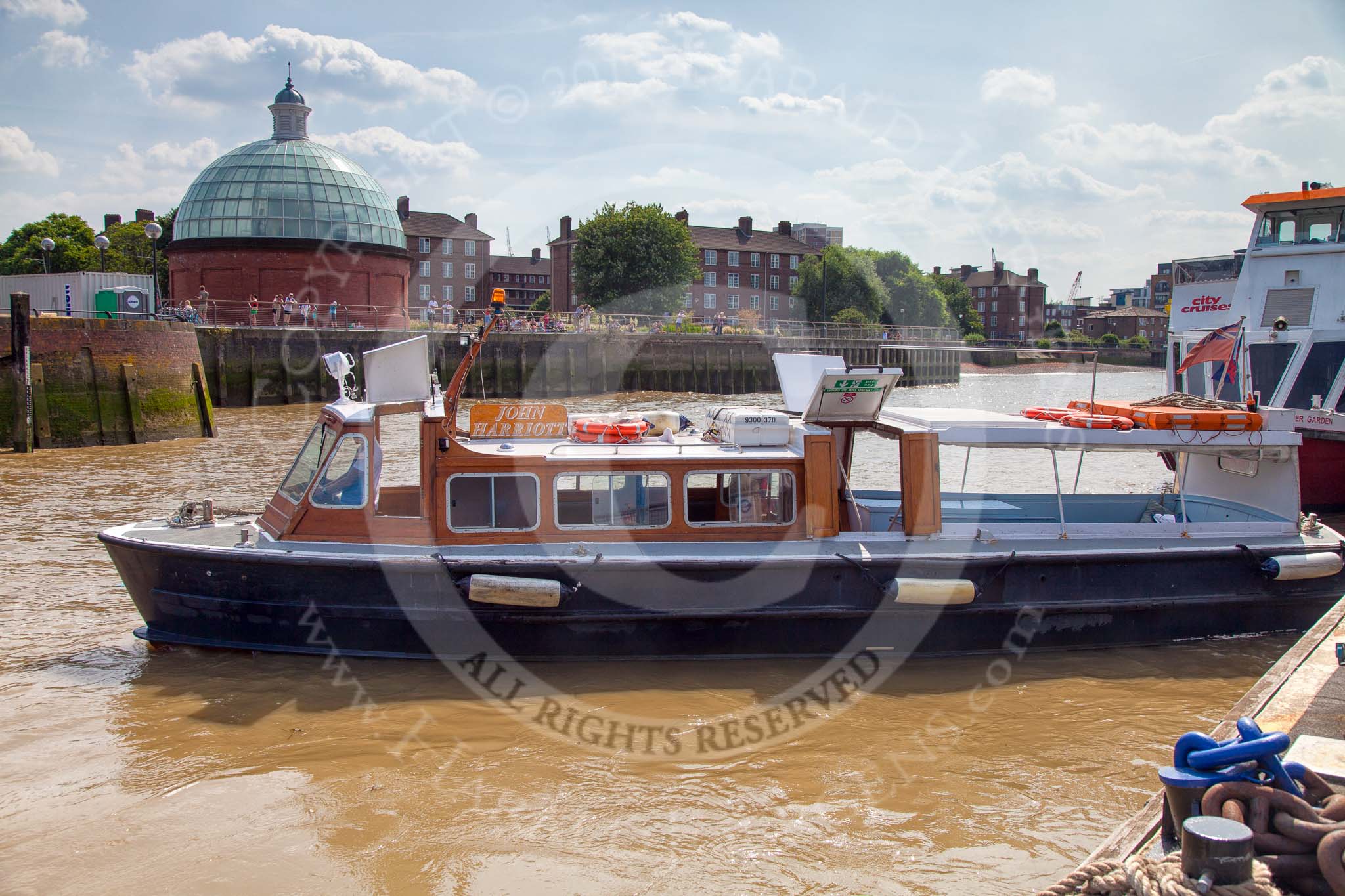 TOW River Thames Barge Driving Race 2013: The high speed Thames Launch "John Harriot", by Thames Executive Charters, leaving Greenwich pier..
River Thames between Greenwich and Westminster,
London,

United Kingdom,
on 13 July 2013 at 15:30, image #554