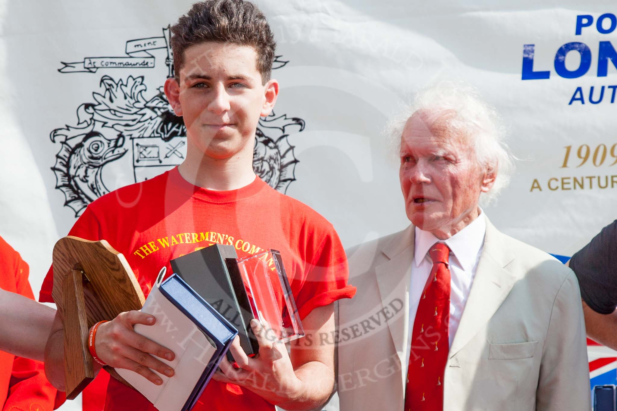 TOW River Thames Barge Driving Race 2013: G. Skingly-Shute, winner of the Darren Lacey Price for the youngest apprentice, together with the chairman of the event, Alan Lee Williams OBE..
River Thames between Greenwich and Westminster,
London,

United Kingdom,
on 13 July 2013 at 16:19, image #566