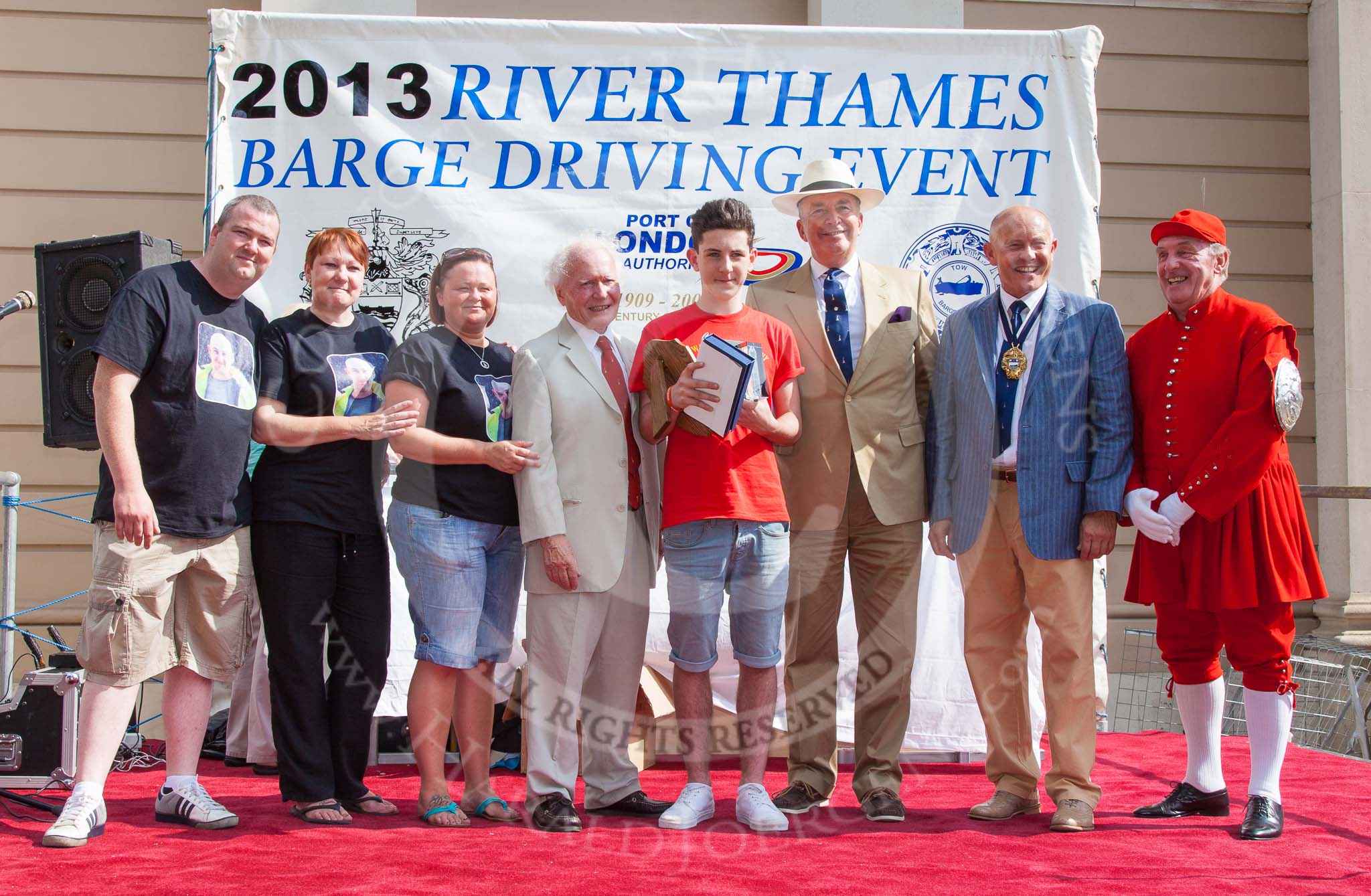 TOW River Thames Barge Driving Race 2013: The Darren Lacey price, presented by the crew of barge Darren Lacey,  for the youngest apprentice, goes to a member of the crew of barge "The Matchgirls" by Unite the Union - G. Skingly-Shute, aged 16 years and 11 months..
River Thames between Greenwich and Westminster,
London,

United Kingdom,
on 13 July 2013 at 16:20, image #567