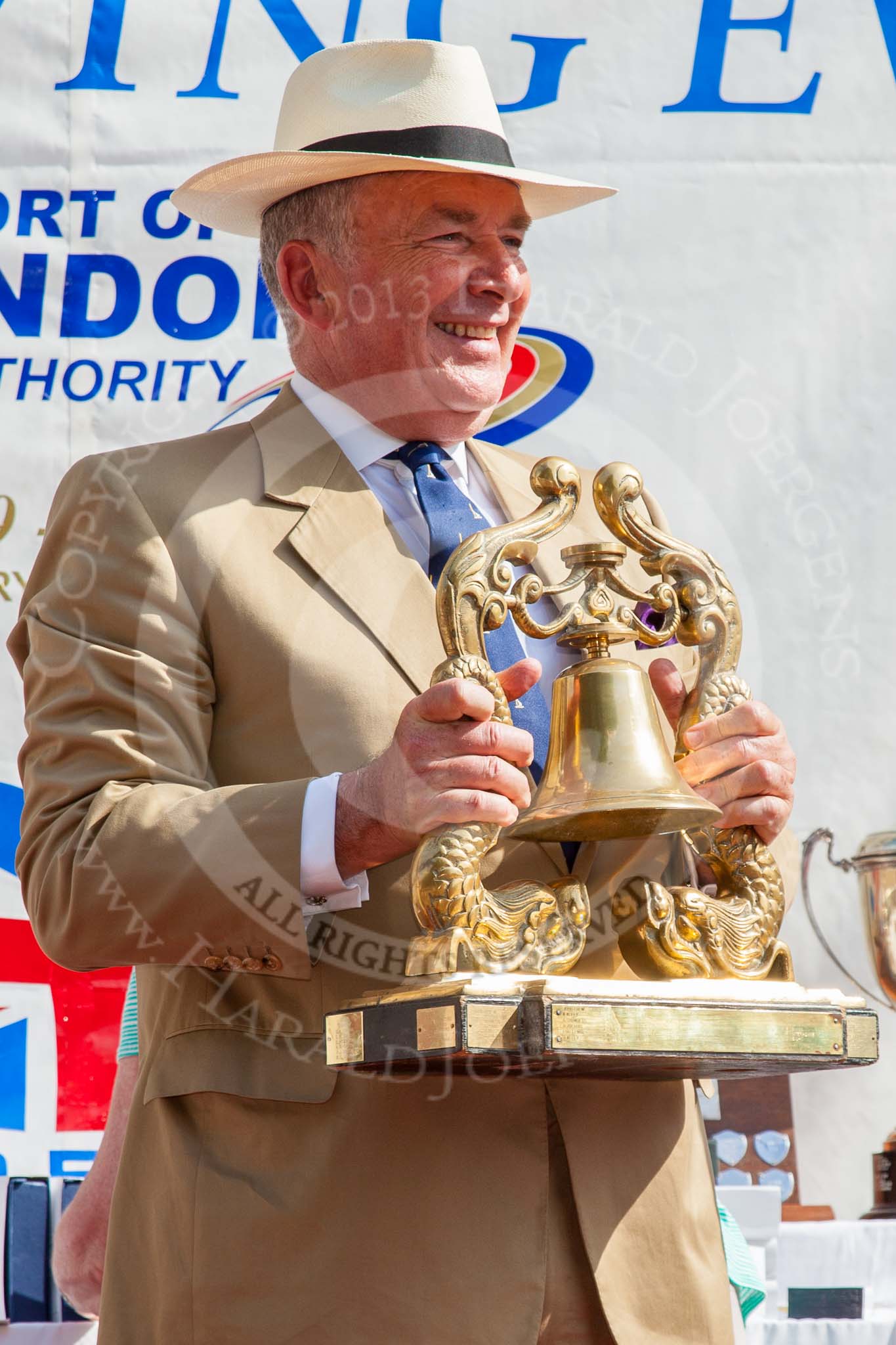 TOW River Thames Barge Driving Race 2013: Admiral Alan West holding the Transport on Water Challenge Trophy at the price-giving..
River Thames between Greenwich and Westminster,
London,

United Kingdom,
on 13 July 2013 at 16:28, image #580