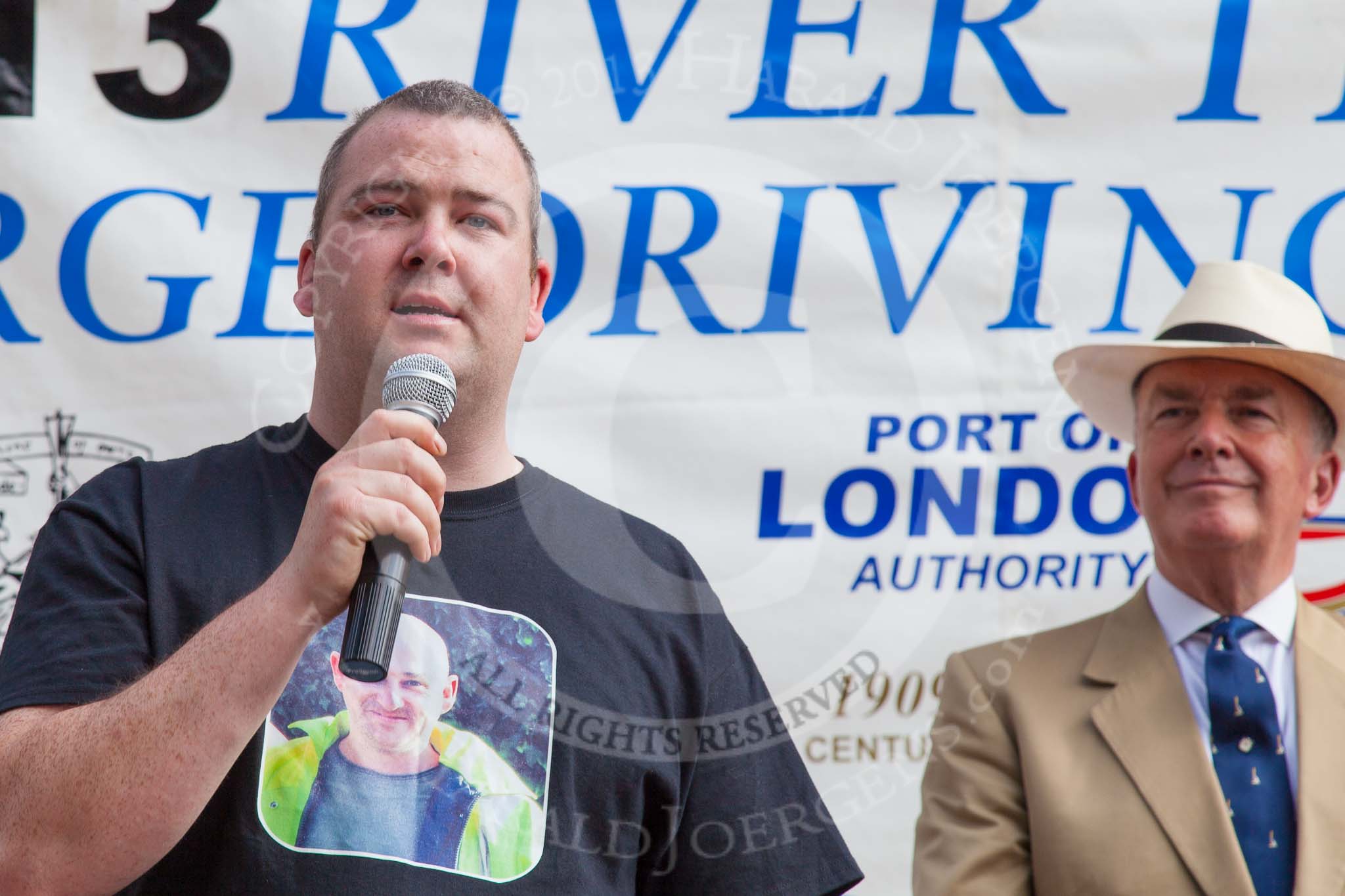 TOW River Thames Barge Driving Race 2013: A crew member of barge "Darren Lacey", by Princess Pocahontas, during a short speech. On the right Admiral Alan West..
River Thames between Greenwich and Westminster,
London,

United Kingdom,
on 13 July 2013 at 16:32, image #584