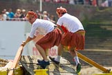 TOW River Thames Barge Driving Race 2013: rowers wearing skirts on the deck of of barge "Hoppy" by GPS Fabrication..
River Thames between Greenwich and Westminster,
London,

United Kingdom,
on 13 July 2013 at 12:36, image #125