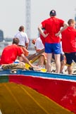 TOW River Thames Barge Driving Race 2013: Rowers on the deck of barge "Hoppy", by GPS Fabrication, seen looking over the deck of barge "Jane", by the RMT Union, during the race..
River Thames between Greenwich and Westminster,
London,

United Kingdom,
on 13 July 2013 at 12:38, image #140