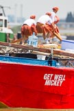 TOW River Thames Barge Driving Race 2013: Rowers on the deck of barge "Hoppy", by GPS Fabrication, seen looking over the deck of barge "Jane", by the RMT Union, during the race..
River Thames between Greenwich and Westminster,
London,

United Kingdom,
on 13 July 2013 at 12:38, image #141