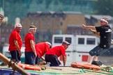 TOW River Thames Barge Driving Race 2013: Rowers on the deck of barge "Spirit of Mountabatten", by Mechanical Movements and Enabling Services Ltd, seen looking over the deck of barge "Darren Lacey", by Princess Pocahontas, during the race..
River Thames between Greenwich and Westminster,
London,

United Kingdom,
on 13 July 2013 at 12:38, image #144
