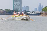 TOW River Thames Barge Driving Race 2013: Barge "Hoppy", by GPS Fabrication, approaching Masthouse Terrace Pier. On the left, only an oar can be seen of barge "Spirit of Mountabatten", by Mechanical Movements and Enabling Services Ltd. In the background the skyscrapers of the City of London..
River Thames between Greenwich and Westminster,
London,

United Kingdom,
on 13 July 2013 at 12:41, image #166