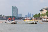 TOW River Thames Barge Driving Race 2013: Barge "Hoppy", by GPS Fabrication, approaching Masthouse Terrace Pier. On the left barge "Spirit of Mountabatten", by Mechanical Movements and Enabling Services Ltd. In the background the skyscrapers of the City of London. On the very left an oar of barge "Darren Lacey"..
River Thames between Greenwich and Westminster,
London,

United Kingdom,
on 13 July 2013 at 12:41, image #168