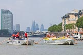 TOW River Thames Barge Driving Race 2013: Barge "Hoppy", by GPS Fabrication, approaching Masthouse Terrace Pier. On the left barge "Spirit of Mountabatten", by Mechanical Movements and Enabling Services Ltd. In the background the skyscrapers of the City of London..
River Thames between Greenwich and Westminster,
London,

United Kingdom,
on 13 July 2013 at 12:41, image #169
