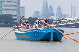 TOW River Thames Barge Driving Race 2013: Rear view of barge "Darren Lacey", by Princess Pocahontas, during the race, approaching Masthouse Terrace Pier. In the background the skyscrapers of the City of London, including the "Gherkin"..
River Thames between Greenwich and Westminster,
London,

United Kingdom,
on 13 July 2013 at 12:41, image #174