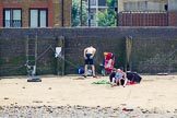 TOW River Thames Barge Driving Race 2013: Young family sunbathing on the beach of the River Thames..
River Thames between Greenwich and Westminster,
London,

United Kingdom,
on 13 July 2013 at 13:23, image #325