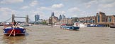 TOW River Thames Barge Driving Race 2013: Barge "Steve Faldo" by Capital Pleasure Boats, and barge "Diana", by Trinity Buoy Wharf, approaching Tower Bridge, On the right the Walkie Talkie- and the Gherkin building..
River Thames between Greenwich and Westminster,
London,

United Kingdom,
on 13 July 2013 at 13:36, image #370