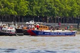 TOW River Thames Barge Driving Race 2013: Barge "Steve Faldo" by Capital Pleasure Boats, behind the finish line at Westminster Bridge, ready to be towed back to Greenwich by tug "Bulldog". Behind them is MV Havengore, hosting VIP guests..
River Thames between Greenwich and Westminster,
London,

United Kingdom,
on 13 July 2013 at 14:33, image #486