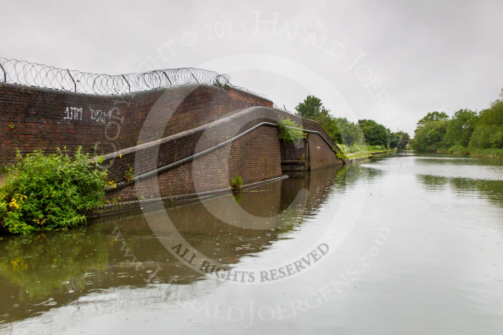 BCN Marathon Challenge 2014: Bridge on the Dudley No 1 Canal leading to a Shropshire Union basin with an old warehouse and stables carrying an LMS advertisment.
Birmingham Canal Navigation,


United Kingdom,
on 25 May 2014 at 06:55, image #212