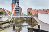 BCN Marathon Challenge 2014: A very modern footbridge over the Birmingham & Fazeley Canal at the Farmers Bridge locks, with old industry on the right. The factory bridge on the right used once served a saw mill..
Birmingham Canal Navigation,


United Kingdom,
on 23 May 2014 at 14:20, image #23