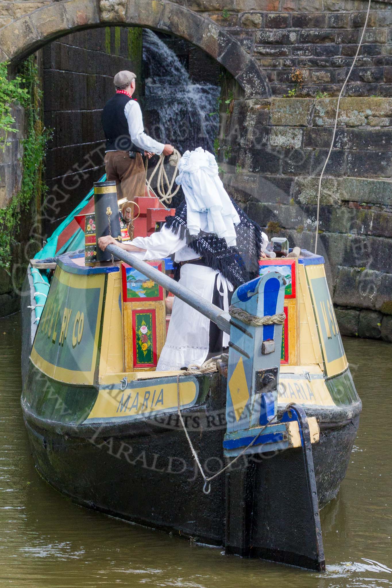 : Barbara Homes (Ashton Packet Boat Co) wearing a traditional bonnet, stears historic narrowboat Maria (built 1854) into of Marple lock 15..




on 03 July 2015 at 18:03, image #94