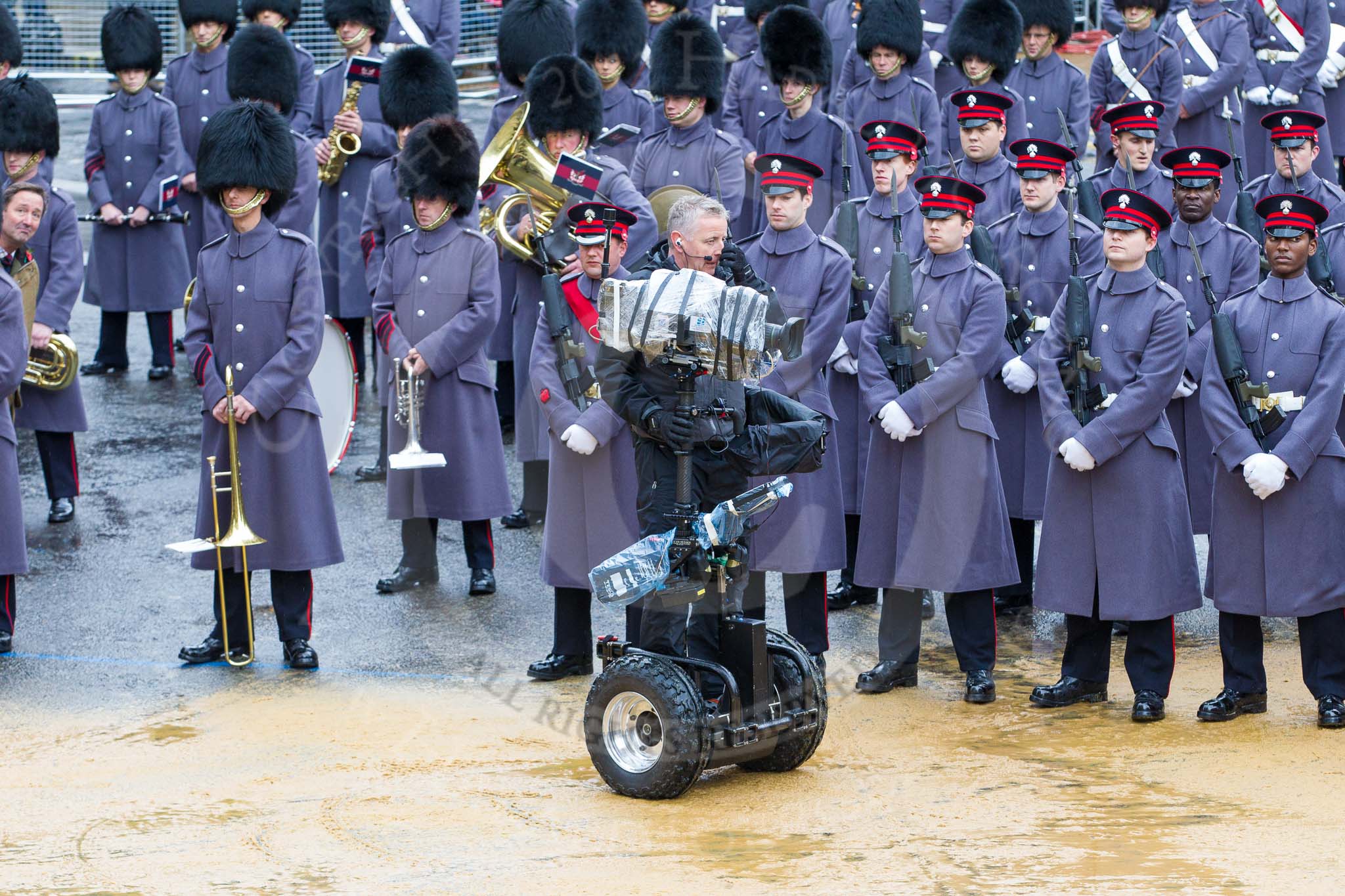 Lord Mayor's Show 2012: The Honourable Artillery Company (HAC) providing the Guard of Honour at the 2012 Lord Mayor's Show, here with the BBC/SIS cameraman and his Segway-mounted camera..
Press stand opposite Mansion House, City of London,
London,
Greater London,
United Kingdom,
on 10 November 2012 at 10:42, image #102