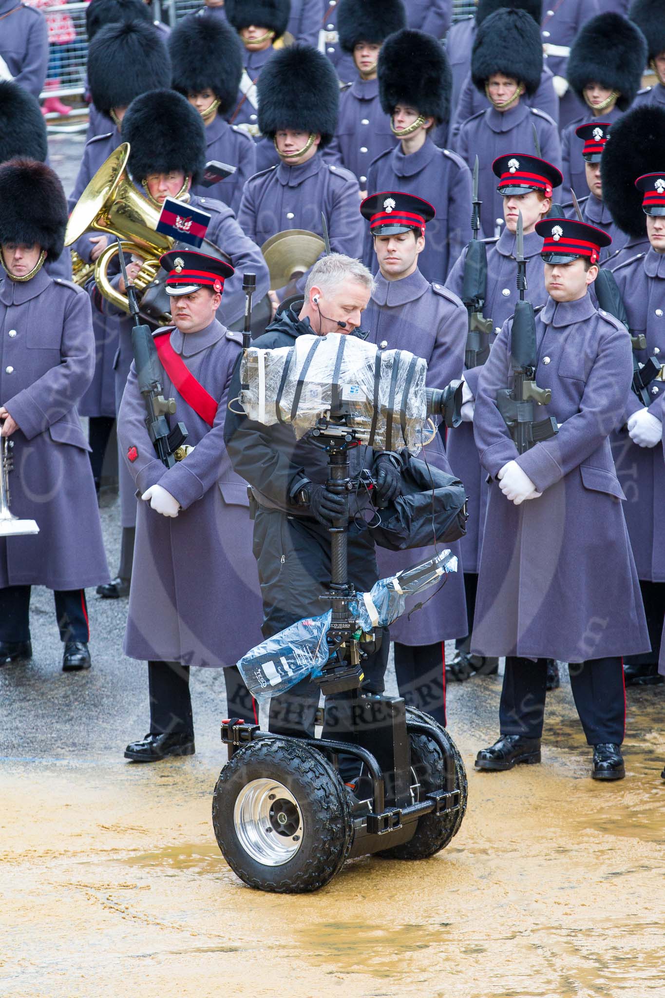 Lord Mayor's Show 2012: The Honourable Artillery Company (HAC) providing the Guard of Honour at the 2012 Lord Mayor's Show, here with the BBC/SIS cameraman and his Segway-mounted camera..
Press stand opposite Mansion House, City of London,
London,
Greater London,
United Kingdom,
on 10 November 2012 at 10:42, image #103