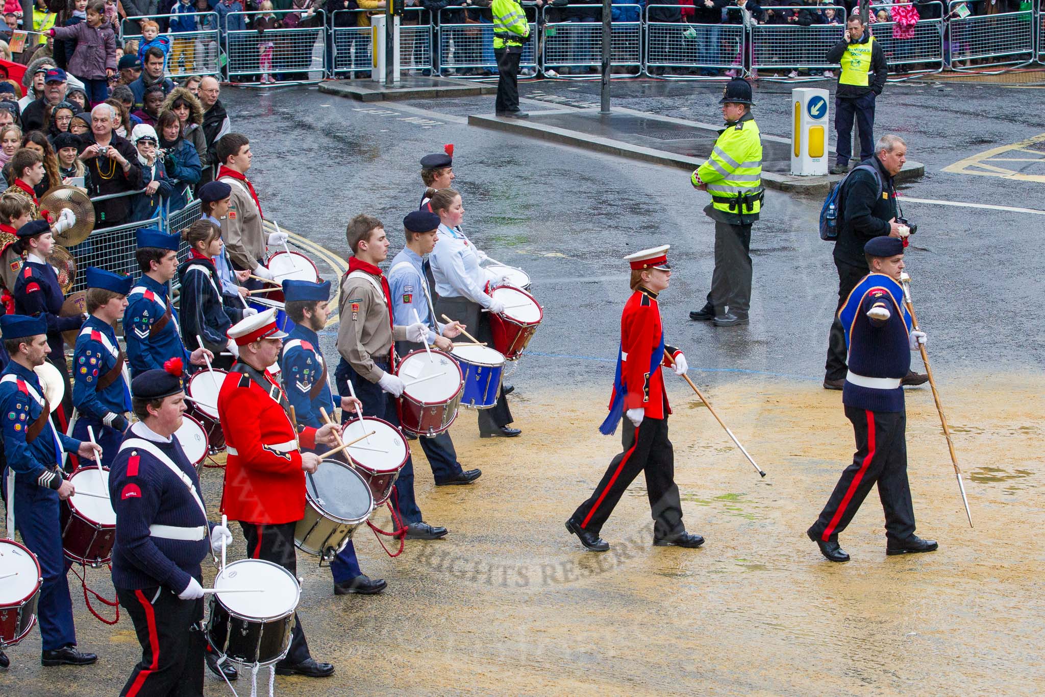 Lord Mayor's Show 2012: Entry 29 - National Youth Marching Band, lead by Senior Drum Major Dean Ongley of the Redhill Corps of Drums & Band..
Press stand opposite Mansion House, City of London,
London,
Greater London,
United Kingdom,
on 10 November 2012 at 11:12, image #459